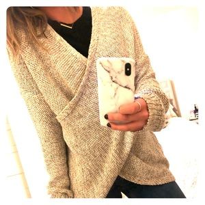Knitted cross body sweater, worn twice.